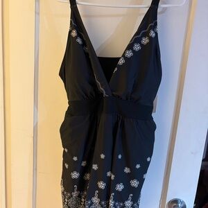 Black swim romper with White Floral Pattern